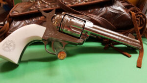 Cimarron PP410LNTXR Frontier Texas Ranger 45 Colt (LC) 6 Shot, 4.75" Engraved Nickel-Plated Steel Barrel, Cylinder & Frame, Engraved "One Riot, One Ranger" Ejector Rod, White Polymer Grip